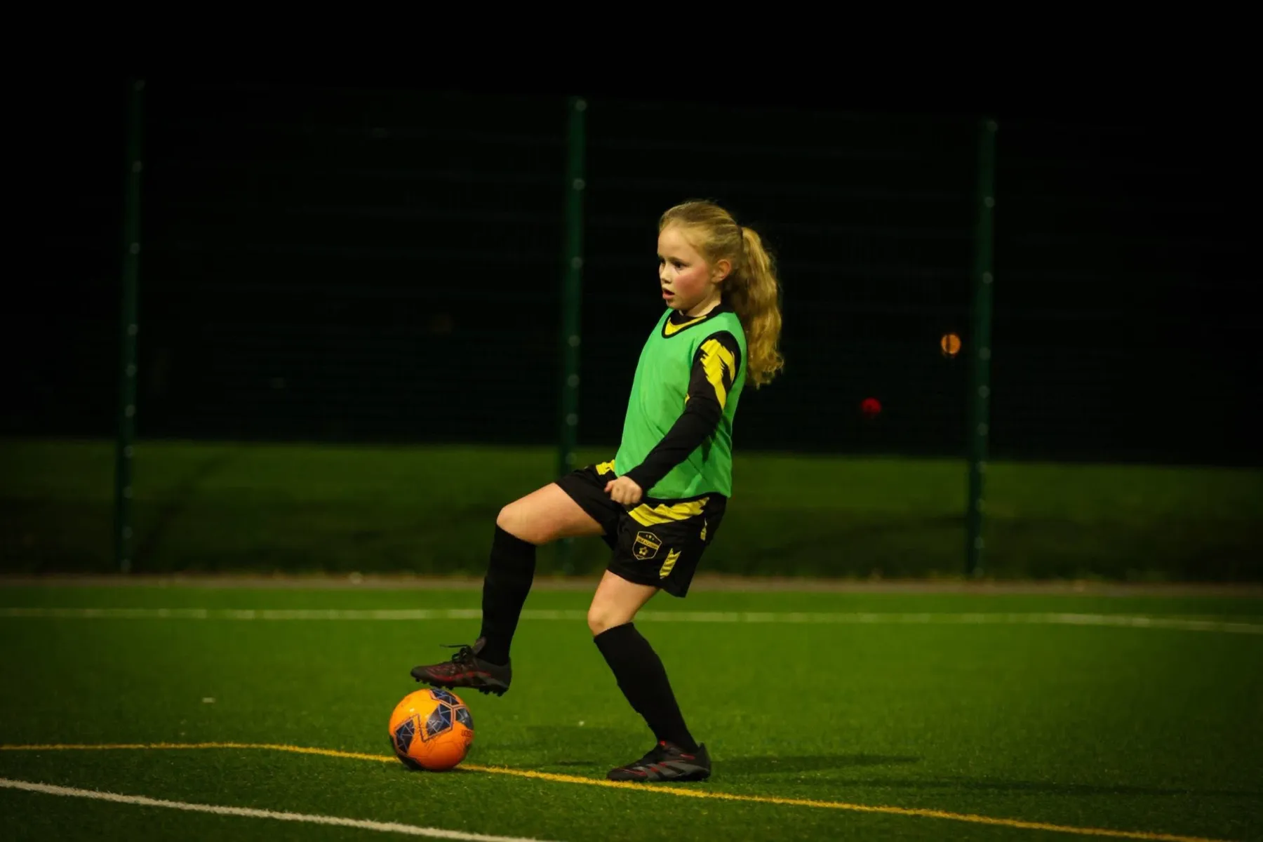 A young player on the ball during a Mini Ballers session