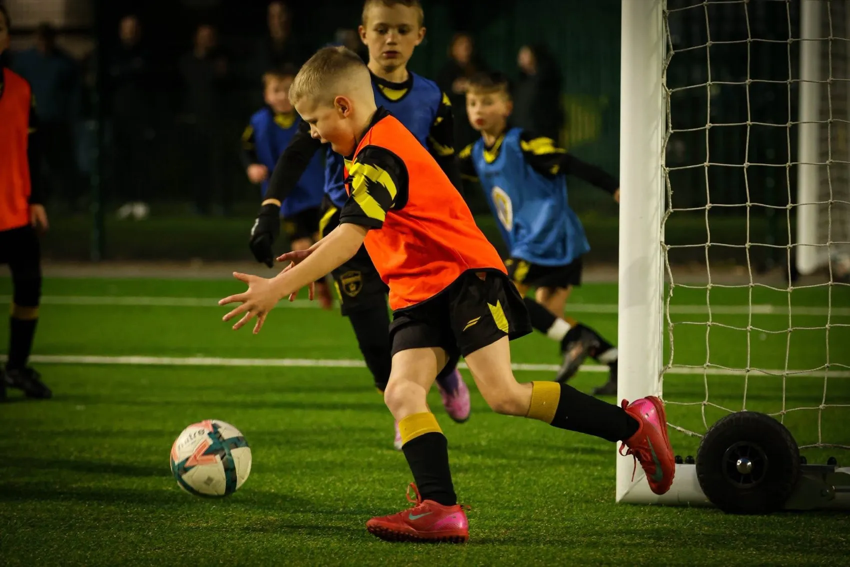 A player striking the ball towards goal in a 1-to-1 session