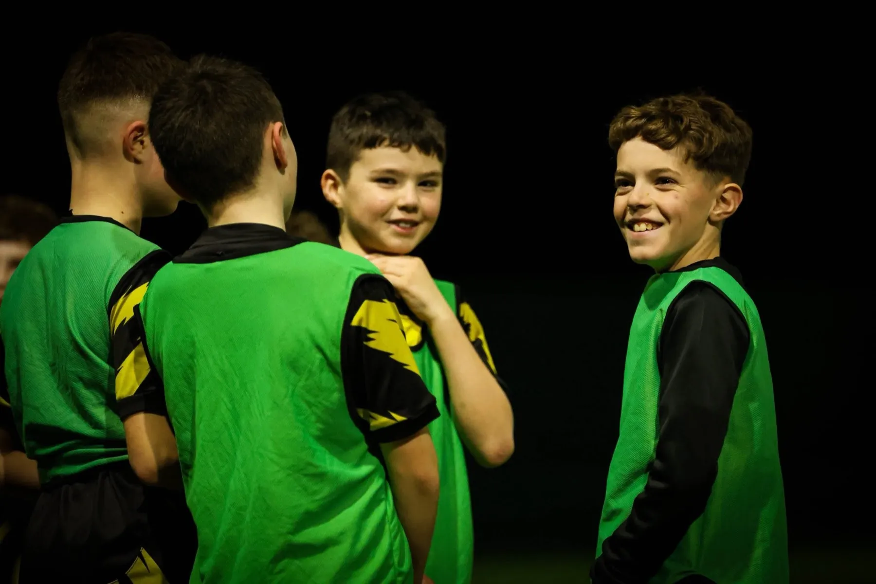 Young DNA Academy players smiling together during a session